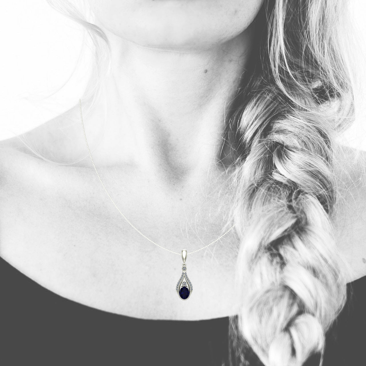 oval blue sapphire and diamond drop pendant in 14k white gold - Charles Babb Designs - on neck