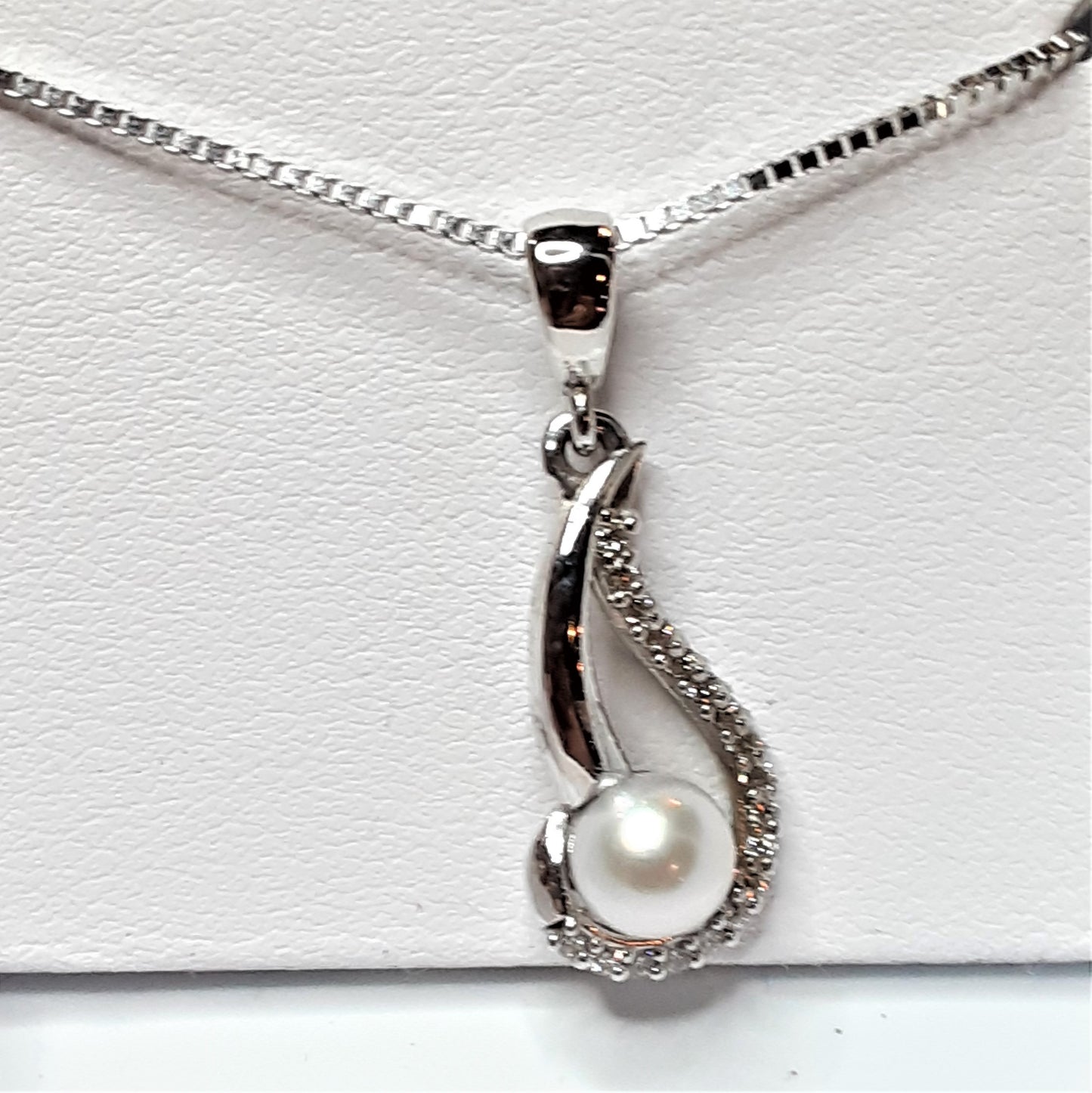 Ready to ship pearl and diamond swirl pendant in 14k white gold