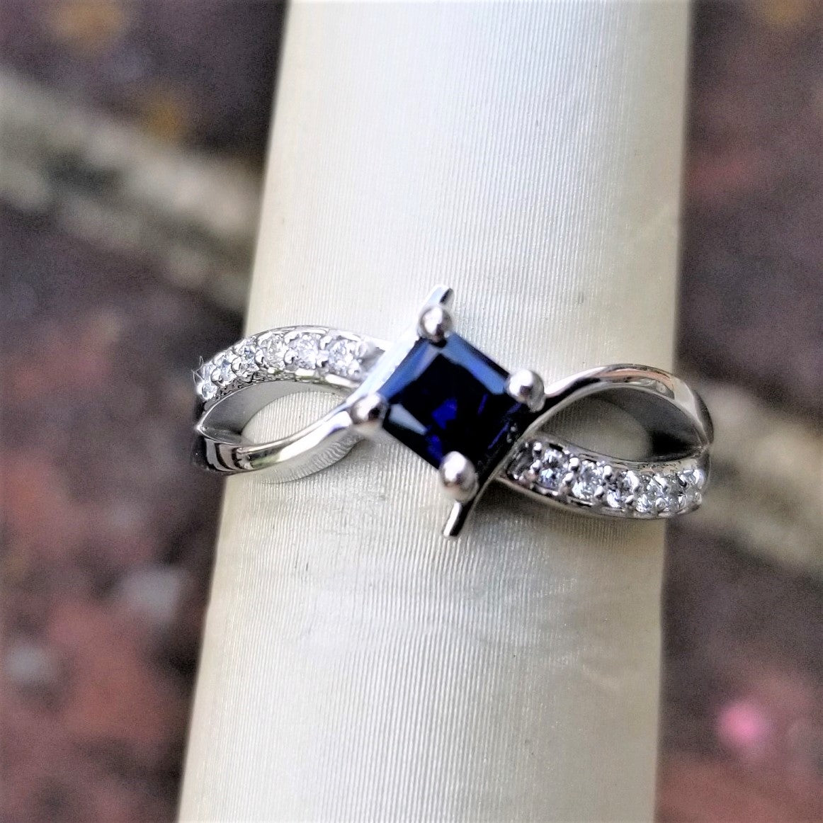 Ready to Ship princess cut lab created blue sapphire bypass ring in 14k white gold