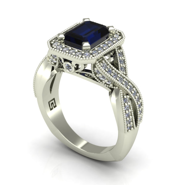 Blue sapphire and diamond emerald cut ring with halo and crossover shank in 14k white gold