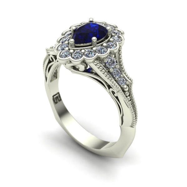 Blue sapphire and diamond pear vintage ring in 18k white gold