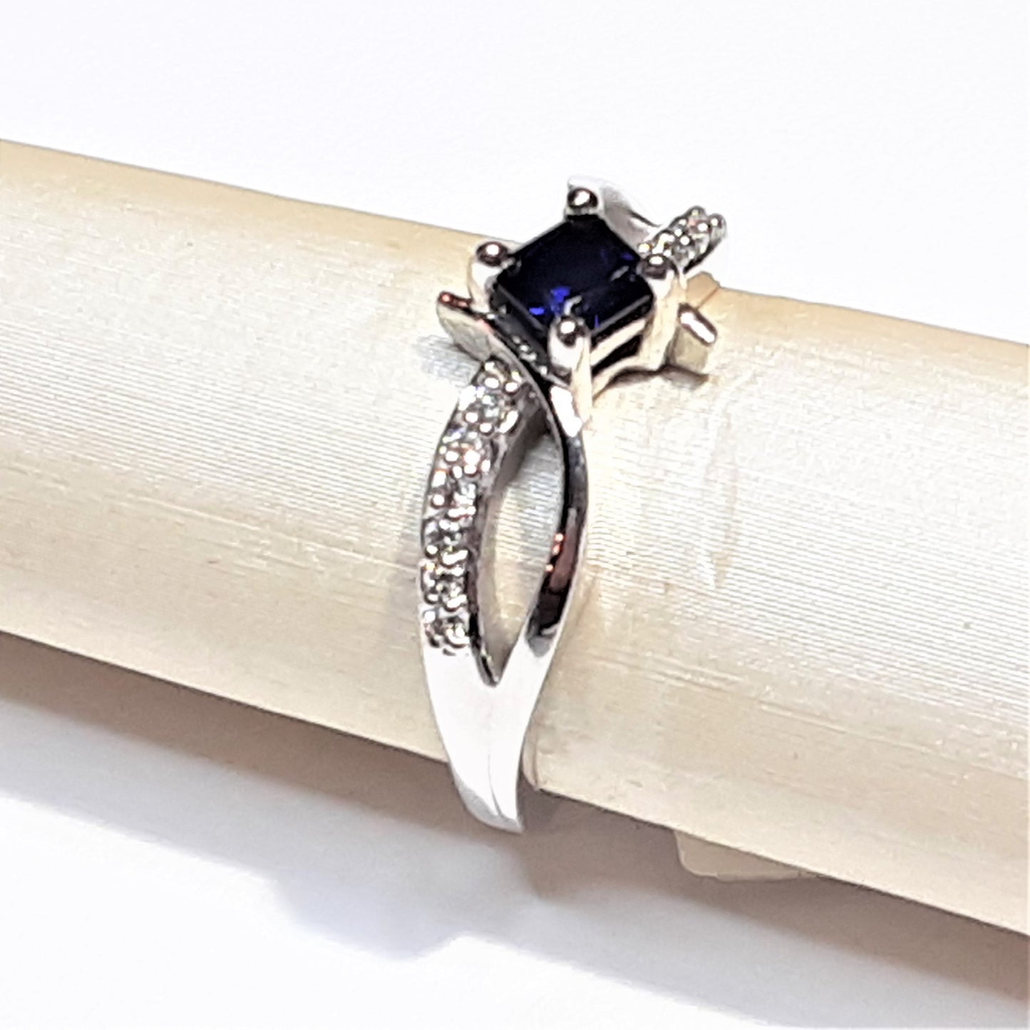 Ready to Ship princess cut lab created blue sapphire bypass ring in 14k white gold